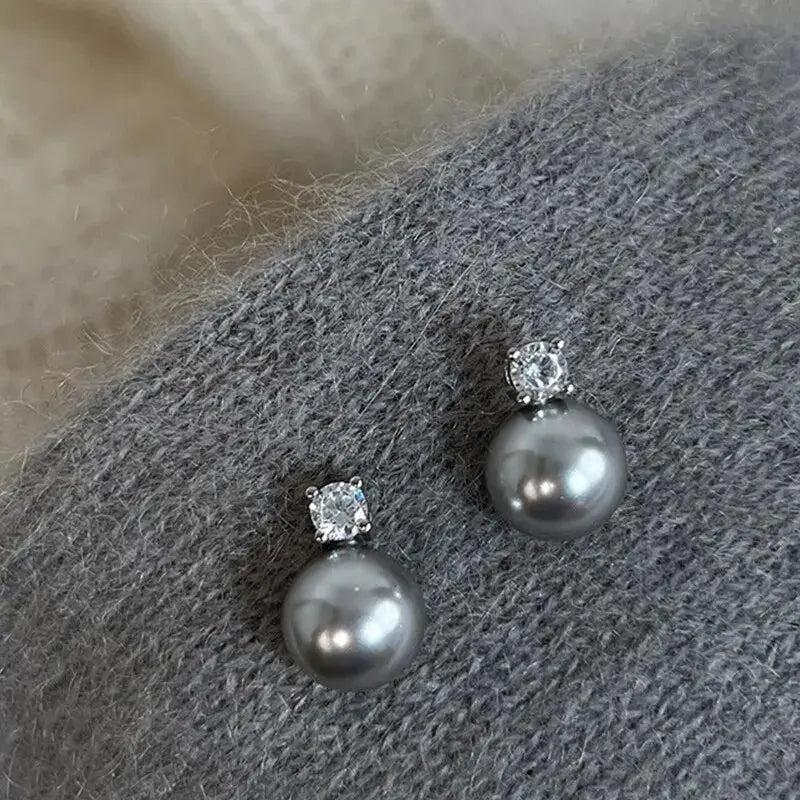 Elegante Ohrringe aus schwarzer Perle mit Zirkonia