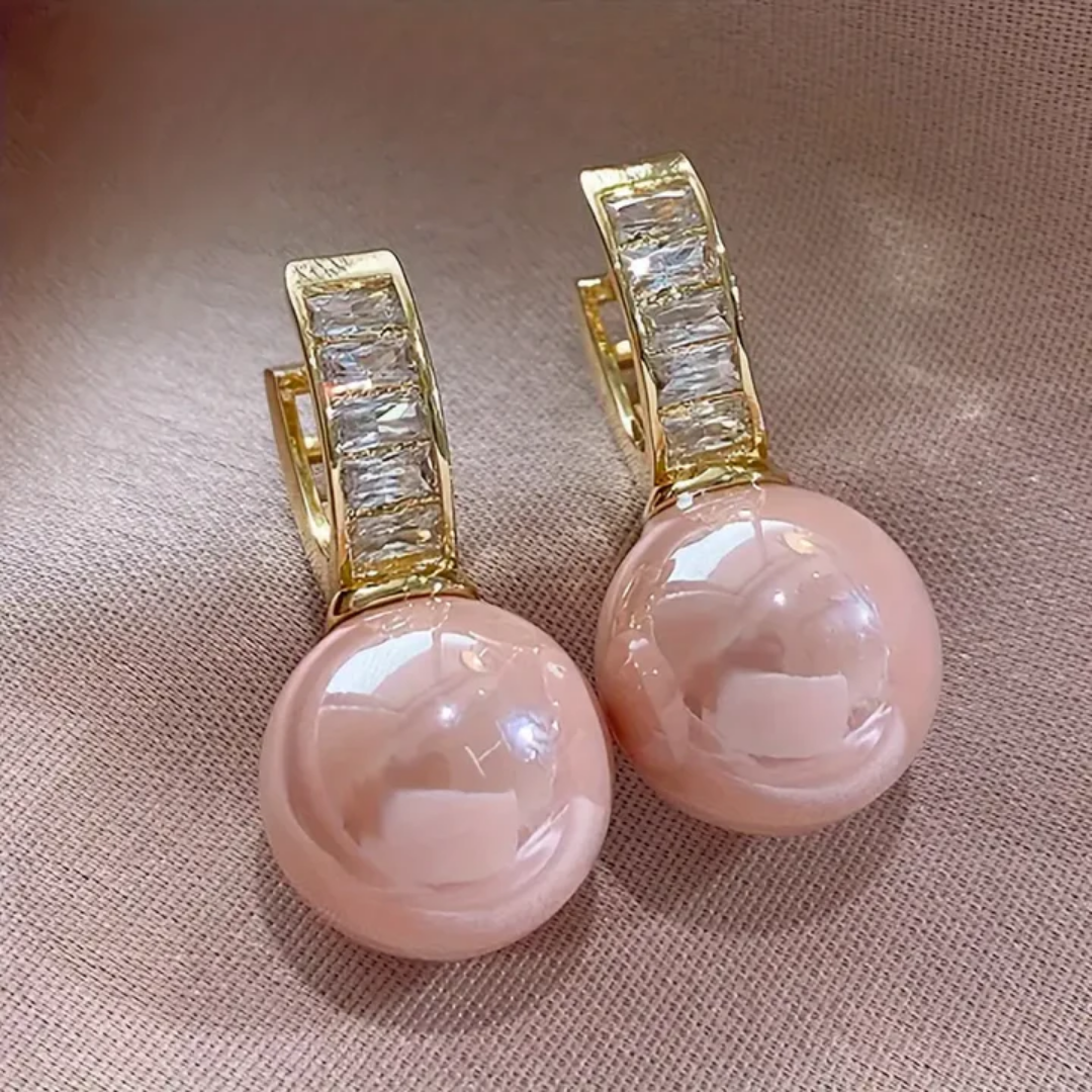 Goldene Ohrringe mit rosa Perle und Zirkon