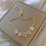 Margueritenarmband aus Kristall in Gold