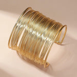 Offenes Armband mit Spirale in Gold