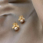 Ohrringe aus Perle und Zirkon in Gold