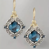Ohrringe aus blauen Kristallen in Gold und Silber