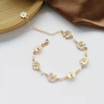 Retro-Armband mit Margeriten, goldenen Details und weissen Blumen
