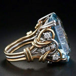 Retro-Goldring mit Schichten aus blauen Zirkonien