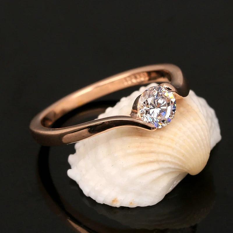 Retro-Ring aus Roségold mit Solitär und runden Diamanten