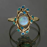 Retro blaues Ring mit Kristallen und Opal