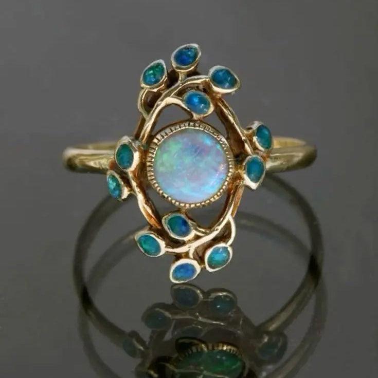 Retro blaues Ring mit Kristallen und Opal