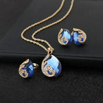 Set aus Halskette und Ohrringen in blauem Kristall mit Gold