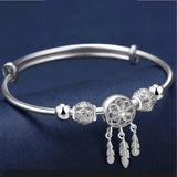 Verstellbares Armband mit Dreiblatt-Medaille in Silber