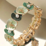 Vintage Armband mit grünen Blumen und Gänseblümchen